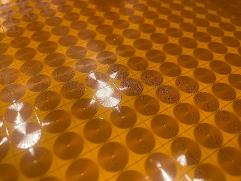 Spiral-coil sensing elements on the flexible substrate of a HELIX sensor wrap, close up